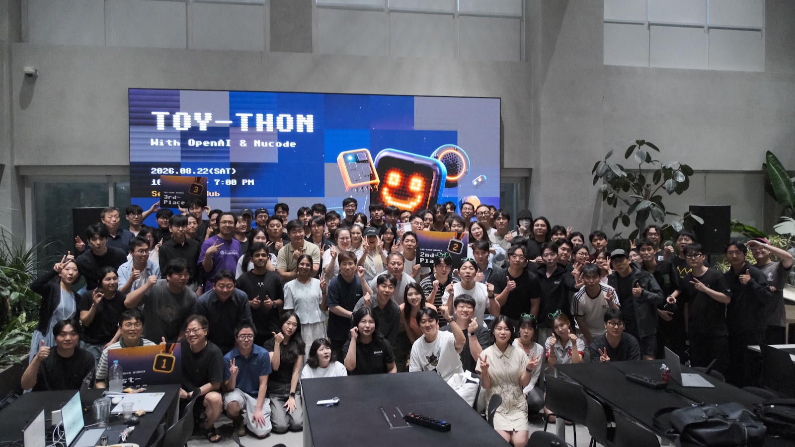 Everyone at Toython, in front of the LED wall at Seoul AI Hub